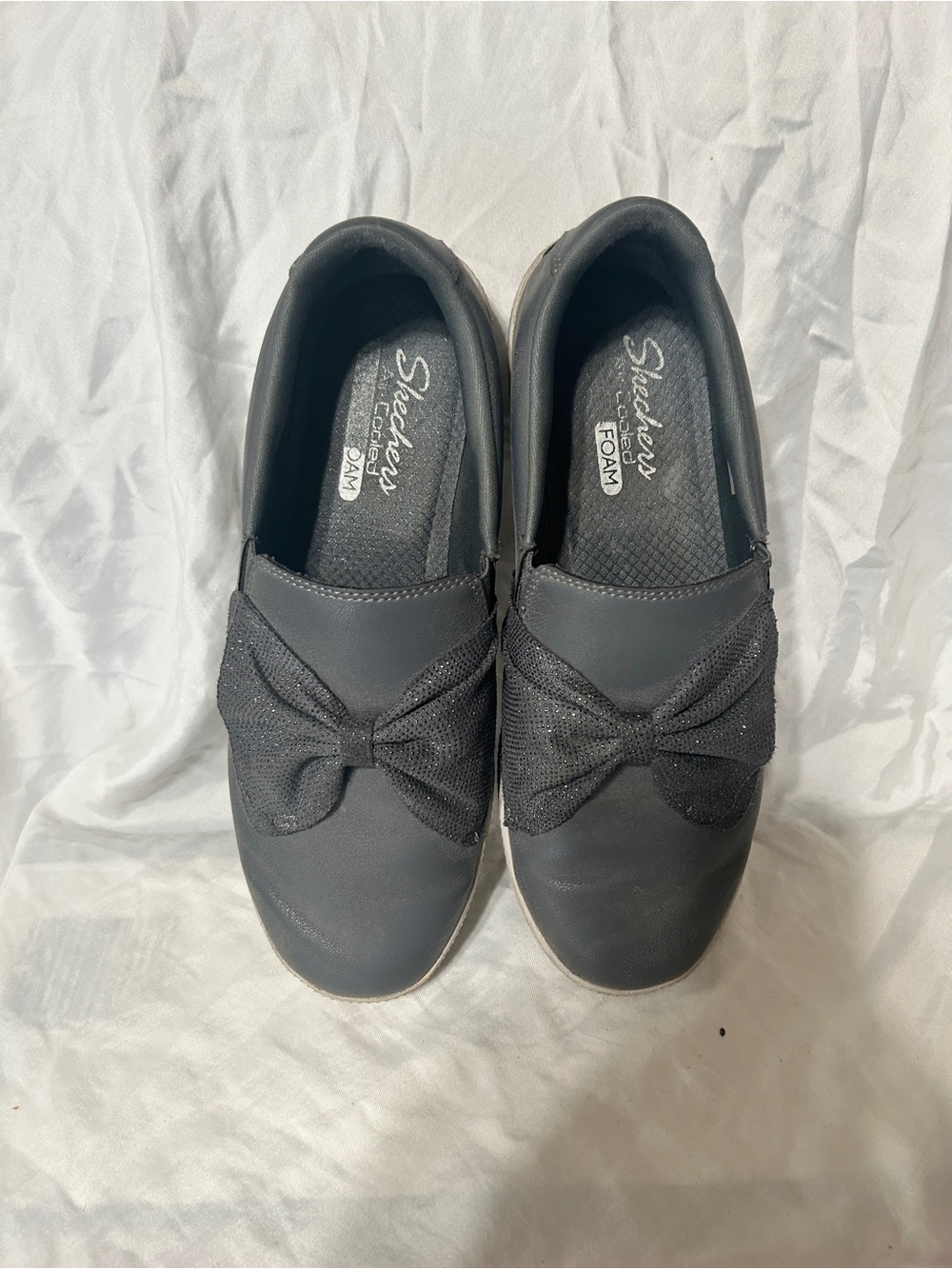 Skechers Women's Black Slip-On Moccasins with Decorative Bow